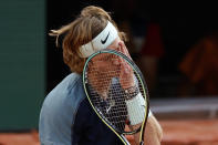 Russia's Andrey Rublev reacts after missing a shot against Croatia's Marin Cilic during their quarterfinal match at the French Open tennis tournament in Roland Garros stadium in Paris, France, Wednesday, June 1, 2022. (AP Photo/Jean-Francois Badias)