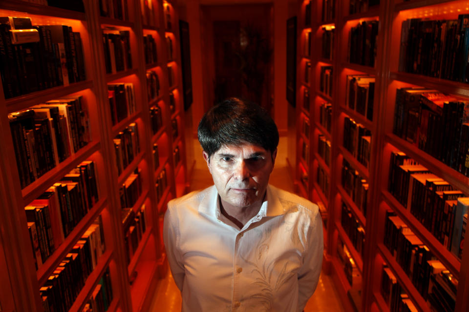 Dean Koontz, prolific book author, is set to come out with his latest work, Odd Apocalypse, the fifth book in a seven book series to be released on July 31st, 2012. Koontz was photographed in the library of his home Newport Coast, an affluent community in Newport Beach, Ca. This section of the library is filled with just his books  6,000 unique editions in 36 different languages, 22 feet of shelving, with 8 shelves on either side that go from floor to ceiling. Koontz said there were perhaps 1,000 other unique editions that were missing from the collection of his own work.  (Photo by Rick Loomis/Los Angeles Times via Getty Images)