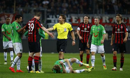 Referee Felix Brych gestures during the German first division Bundesliga soccer match between Eintracht Frankfurt and Hanover 96 in Frankfurt, April 17, 2014. REUTERS/Kai Pfaffenbach