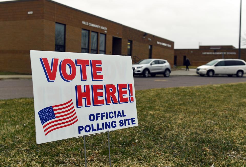 A sign indicating a polling site stands in the grass outside the MariCar Community Center on Tuesday, April 12, 2022.