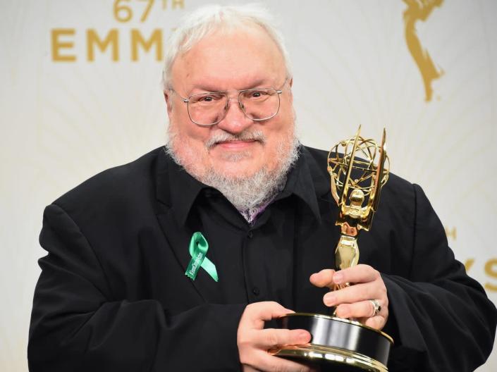 Martin holds aloft the Emmy for Outstanding Drama Series awarded to ‘Game of Thrones’ in 2015 (Getty)