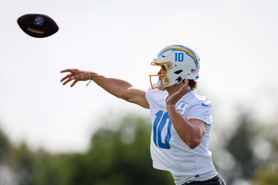 COSTA MESA, CA - JULY 27: Justin Herbert #10 of the Los Angeles Chargers attempts a pass during training camp at Jack Hammett Sports Complex on July 27, 2022 in Costa Mesa, California. (Photo by Scott Taetsch/Getty Images)