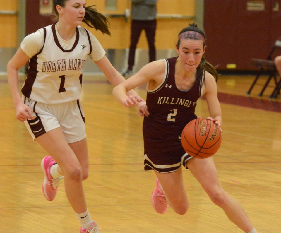 Killingly senior Laura Farquhar moves past North Haven's Lia Calderon during the Class MM state tourney opener at North Haven High School.