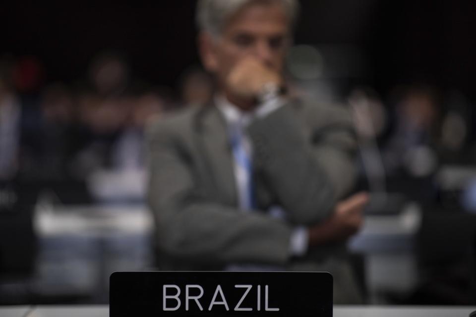 A member of the Brazil delegation during the closing plenary at the COP25 summit in Madrid, Sunday Dec. 15, 2019. Negotiators from almost 200 nations planned to gather for a final time at the U.N. climate meeting in Madrid early Sunday to pass declarations calling for greater ambition in cutting planet-heating greenhouse gases and in helping poor countries suffering the effects of climate change. But one of the key issues at the talks, an agreement on international carbon markets, has eluded officials even after the Chilean chair extended Friday's talks deadline to allow more time for negotiations. (AP Photo/Bernat Armangue)