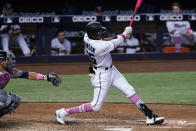 Miami Marlins right fielder Lewis Brinson (25) hits a solo home run in the seventh inning of a baseball game against the Milwaukee Brewers, Sunday, May 9, 2021, in Miami. (AP Photo/Marta Lavandier)