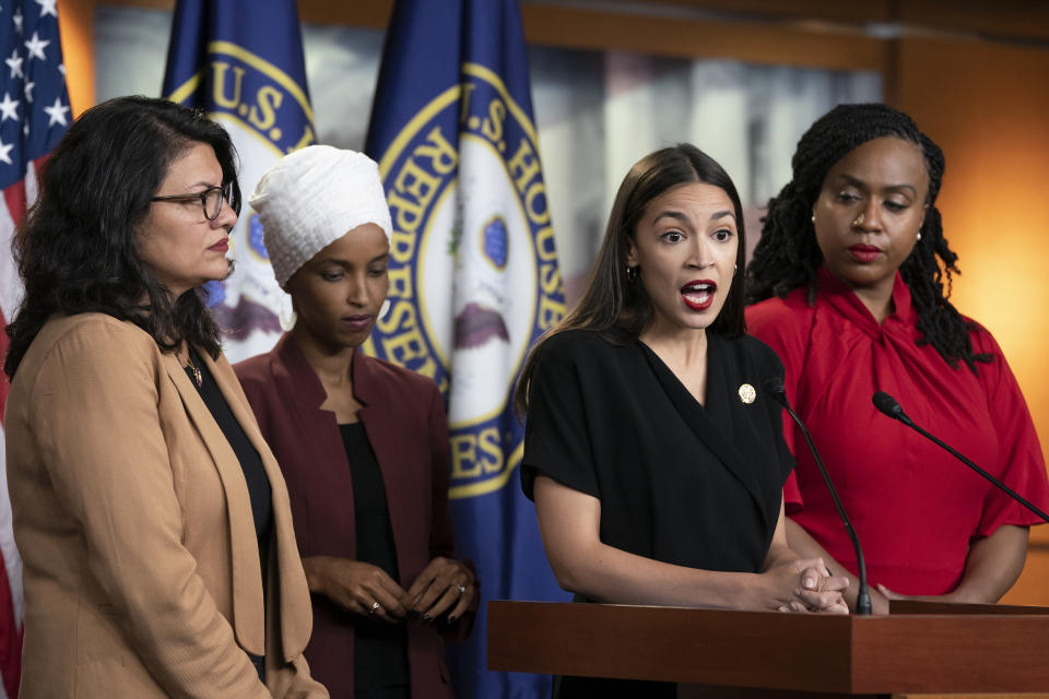 In this July 15, 2019, photo, Rep. Alexandria Ocasio-Cortez, D-N.Y., speaks as, from left, Rep. Rashida Tlaib, D-Mich., Rep. Ilhan Omar, D-Minn., and Rep. Ayanna Pressley, D-Mass., listen during a news conference at the Capitol in Washington. Long before President Donald Trump attacked the four Democratic congresswomen of color, saying they should “go back” to their home countries, they were targets of hateful rhetoric and disinformation online.(AP Photo/J. Scott Applewhite)