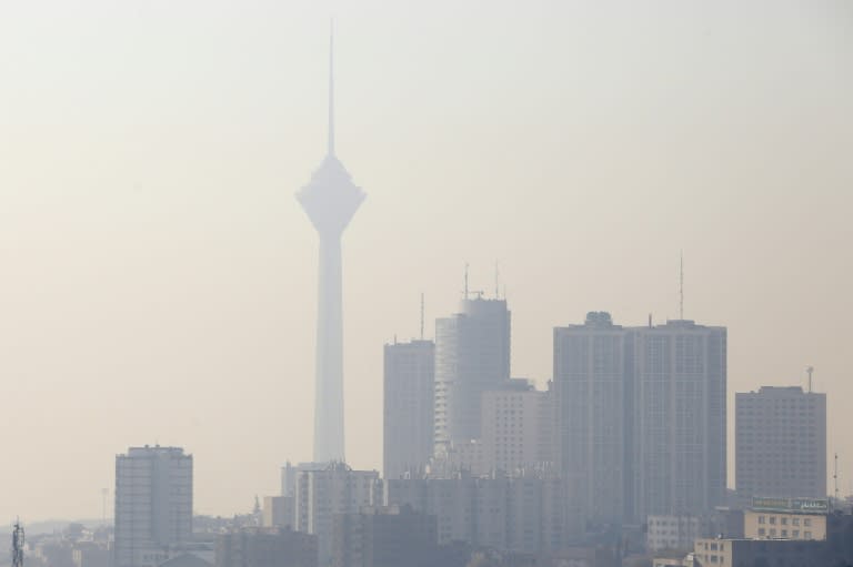 The Milad telecommunications tower in Tehran is blanketed under heavy smog as winter pollution smothers the Iranian capital on December 17, 2017