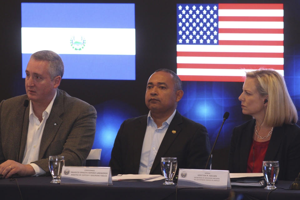 US Secretary of Homeland Security Kirstjen Nielsen, right, sits alongside Guatemala's Interior Minister Enrique Degenhart, left, and El Salvador Minister of Justice and Public Security Mauricio Ramirez Landaverde, at the start of a meeting on migration and security issues between Nielsen and government ministers from the Northern Triangle countries of Central America, in San Salvador, El Salvador, Wednesday, Feb. 20, 2019. (AP Photo/Salvador Melendez)
