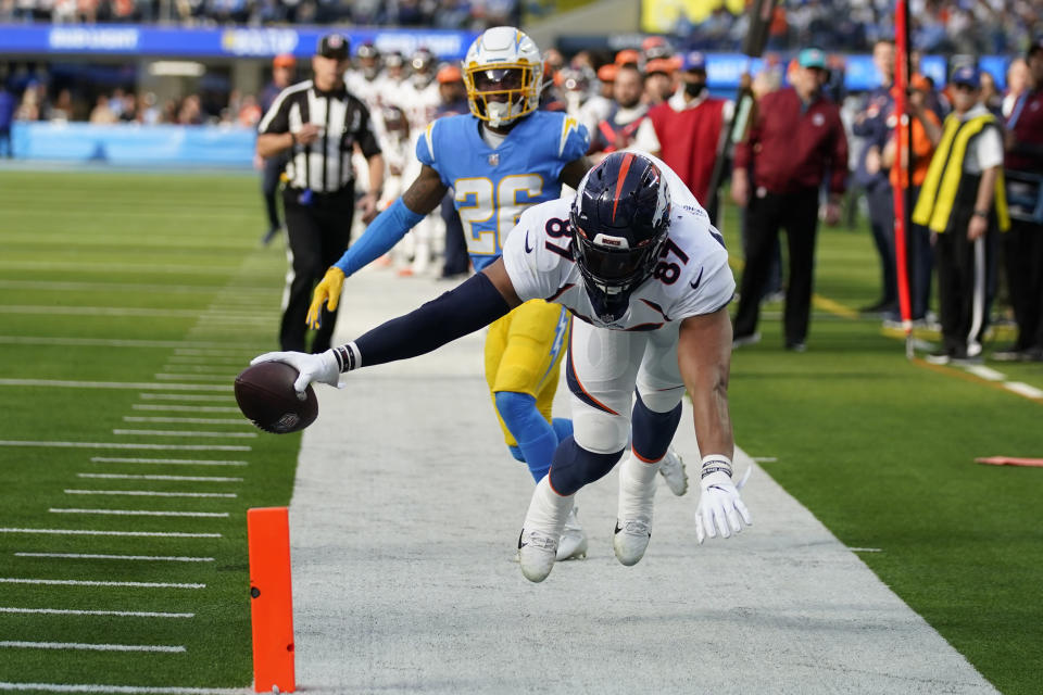 Denver Broncos tight end Noah Fant reaches for the pylon but fails to score during the first half of an NFL football game against the Los Angeles Chargers Sunday, Jan. 2, 2022, in Inglewood, Calif. (AP Photo/Jae C. Hong )