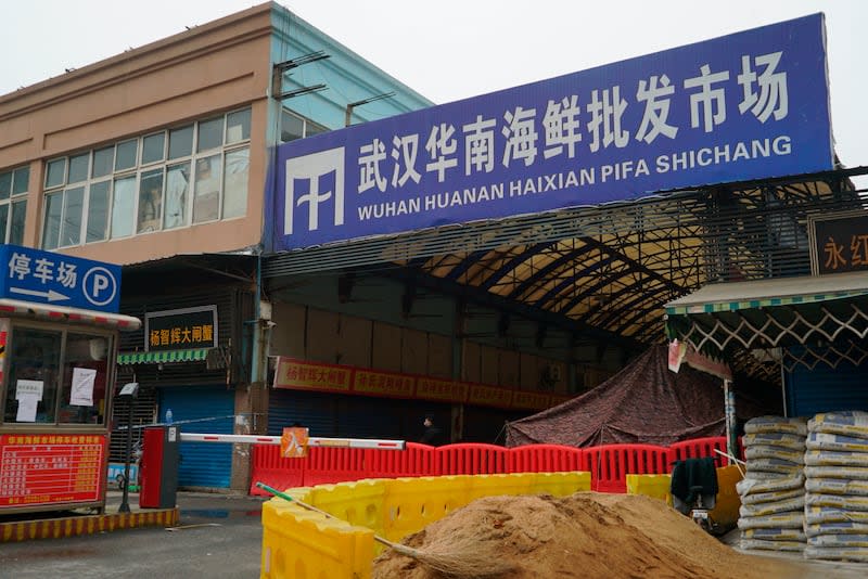The Huanan Seafood Wholesale Market sits closed in Wuhan in central China's Hubei province on Jan. 21, 2020. International scientists have examined previously unavailable genetic data from samples collected at a market in China close to where the first human cases of COVID-19 were detected and said they have found suggestions the pandemic originated from animals, not a lab. | Dake Kang