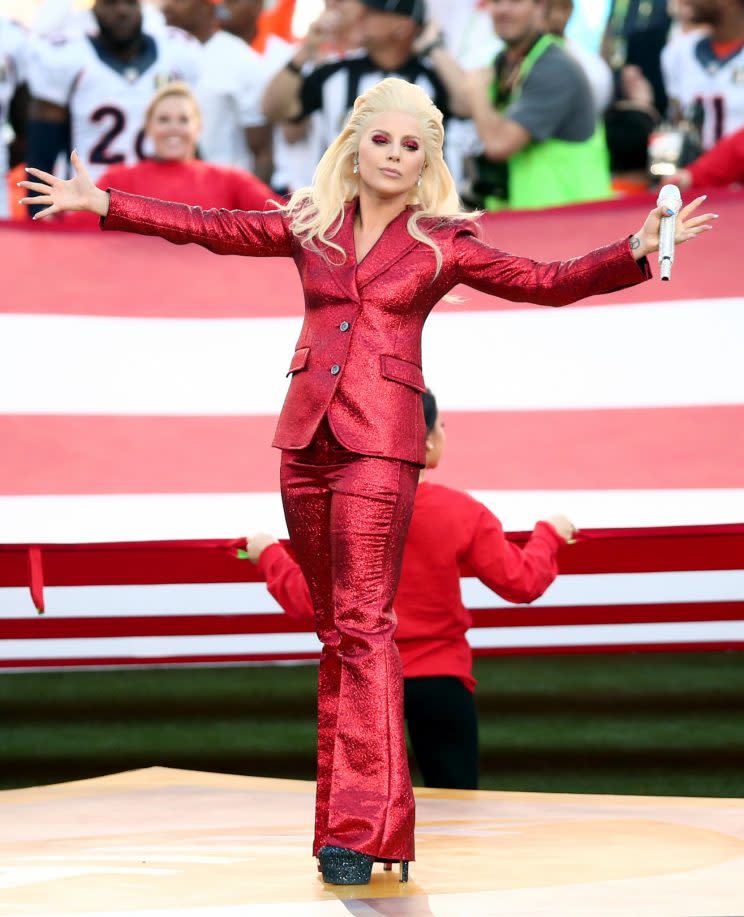 Lady Gaga in a sparkling Tom Ford suit at the 2016 Super Bowl [Photo: Getty]