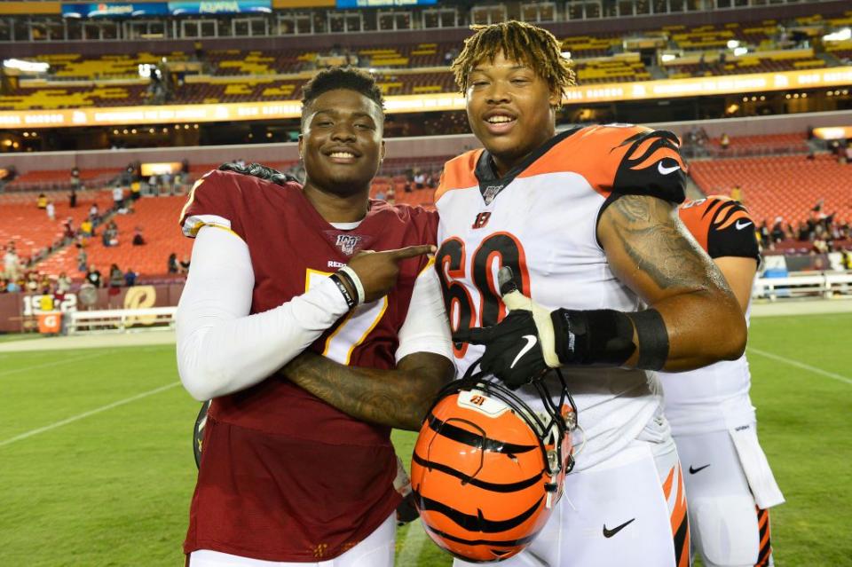 LANDOVER, MD - AUGUST 15: Dwayne Haskins #7 of the Washington Redskins and Mike Jordan #60 of the Cincinnati Bengals take a photo after a preseason game at FedExField on August 15, 2019 in Landover, Maryland. The Bengals defeated the Redskins 23-13. (Photo by Patrick McDermott/Getty Images)