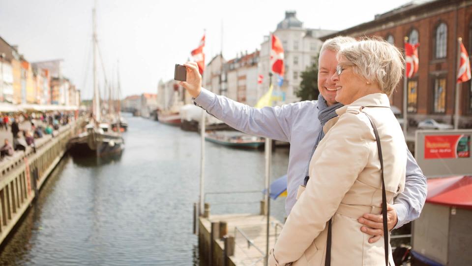 elderly couple on an outing by the docks