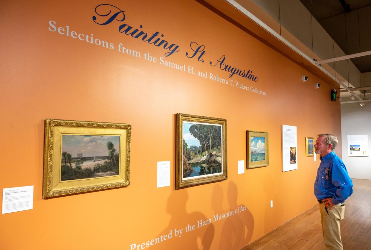 Billy Triay, property manager for the University of Florida Historic St. Augustine, looks at a painting in a gallery in the Governor's House Cultural Center and Museum in St. Augustine on Thursday, May 12, 2022. The "Painting St. Augustine" exhibit is from UF's Harn Museum of Art's "The Florida Art Collection." The collection was a gift from Samuel and Roberta Vickers and features paintings of Florida. The exhibit opened on Friday, May 13, and it is free to the public. Exhibit hours are 10 a.m. to 5 p.m. Wednesday through Sunday.