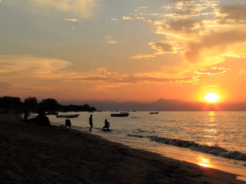 "At new year, we headed to Cape Maclear at the lake, looking out at fishermen gliding past in dug-out canoes" - Credit: AP