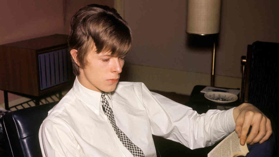 David Bowie reading a book in 1966