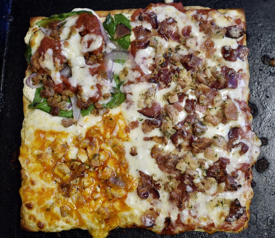 A pizza with toppings selected by the slice is shown in this 2016 file photo.