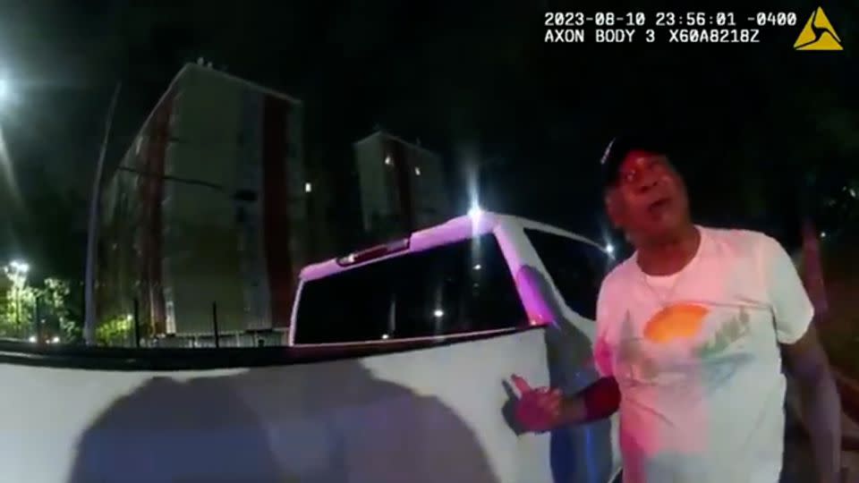 This image from bodycam video provided by the Atlanta Police Department shows Johnny Hollman Sr. speaking with Officer Kiran Kimbrough on August 10, 2023. - Atlanta Police