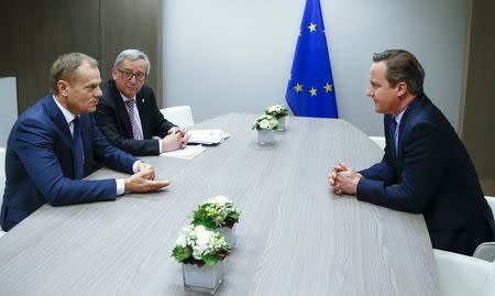 British Prime Minister David Cameron (R) attends a meeting with European Council President Donald Tusk (L) and European Commission President Jean Claude Juncker (C) during a European Union leaders summit addressing the talks about the so-called Brexit and the migrants crisis, in Brussels, Belgium, February 19, 2016. REUTERS/Yves Herman