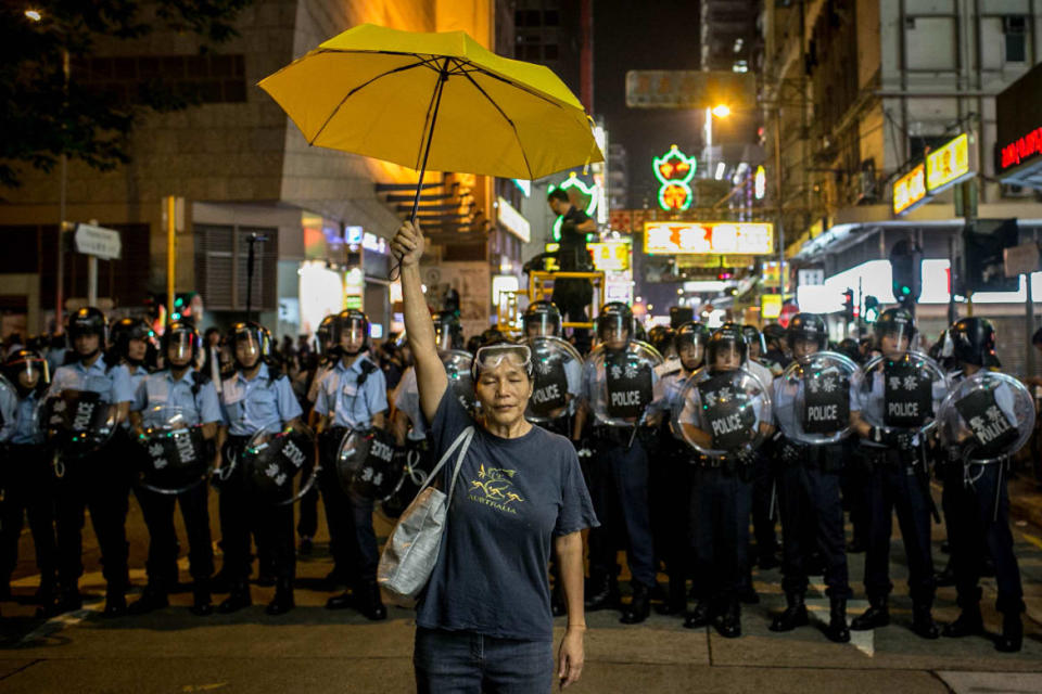 <div class="inline-image__caption"><p>A pro-democracy activist holds a yellow umbrella in front of a police line on a street in Mongkok district on November 25, 2014 in Hong Kong. The Mong Kok protest site is scheduled for clearance by bailiffs this week after Hong Kong's high court authorized police to arrest protesters who obstruct bailiffs on the three interim restraining orders.</p></div> <div class="inline-image__credit">Chris McGrath/Getty</div>