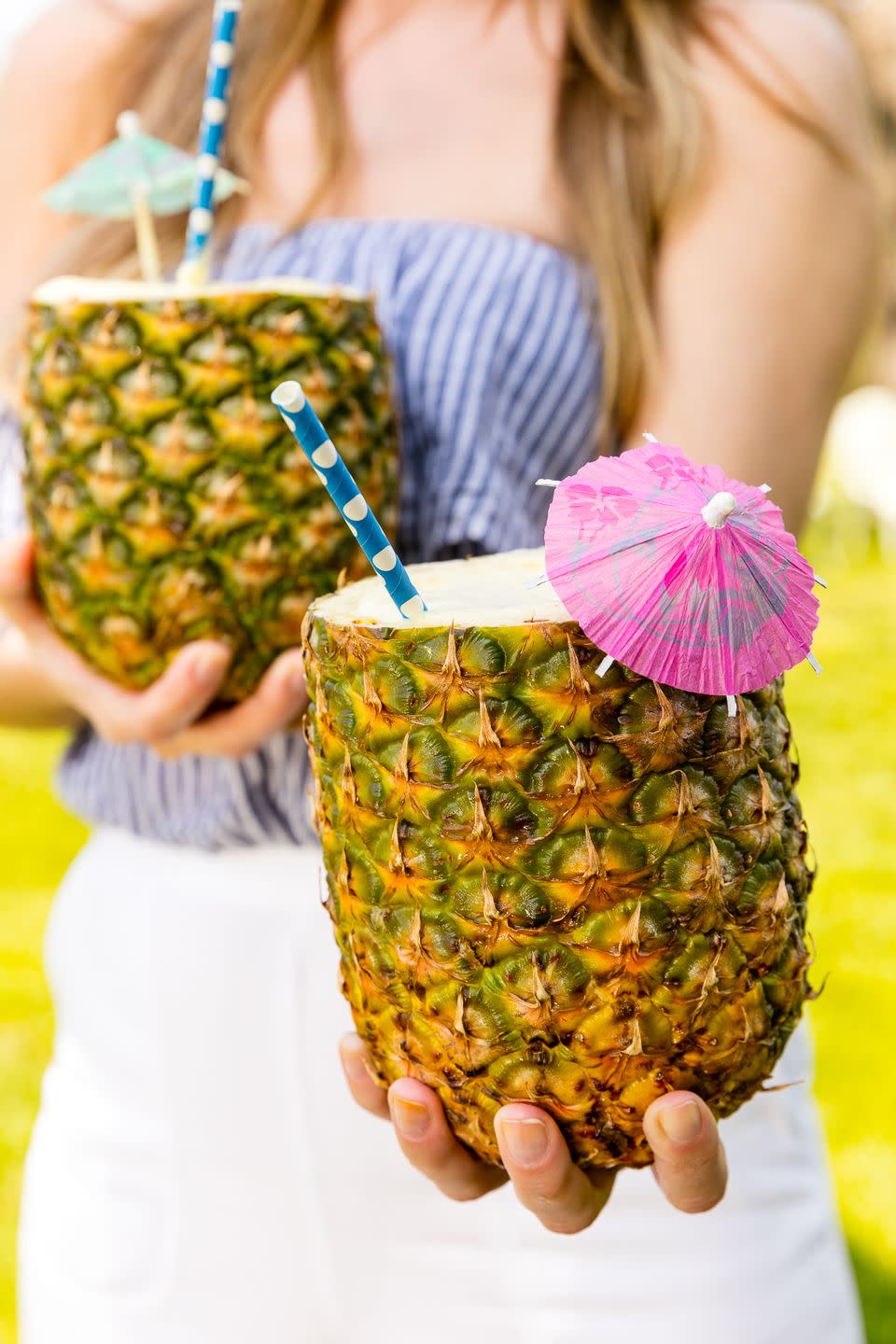 <p>Master the art of tiki mixology. </p><p>Get the recipe from <a href="https://www.delish.com/cooking/recipes/a47276/pina-colada-pineapple-cups/" rel="nofollow noopener" target="_blank" data-ylk="slk:Delish;elm:context_link;itc:0;sec:content-canvas" class="link ">Delish</a>.</p>