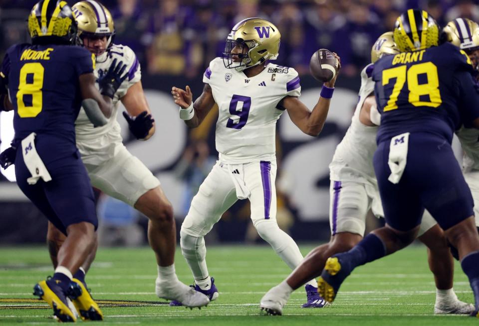 PHOTO: Michael Penix Jr. #9 of the Washington Huskies throws the ball in the first quarter against the Michigan Wolverines during the 2024 CFP National Championship game at NRG Stadium on Jan. 08, 2024 in Houston, Texas.  (Gregory Shamus/Getty Images)