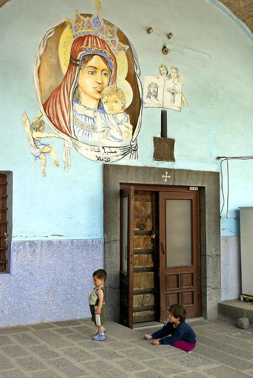 Syriac children play at the Hagia Sophia Syriac Orthodox monastery, in the Turkish southeastern city of Diyarbakir, May 30, 2004