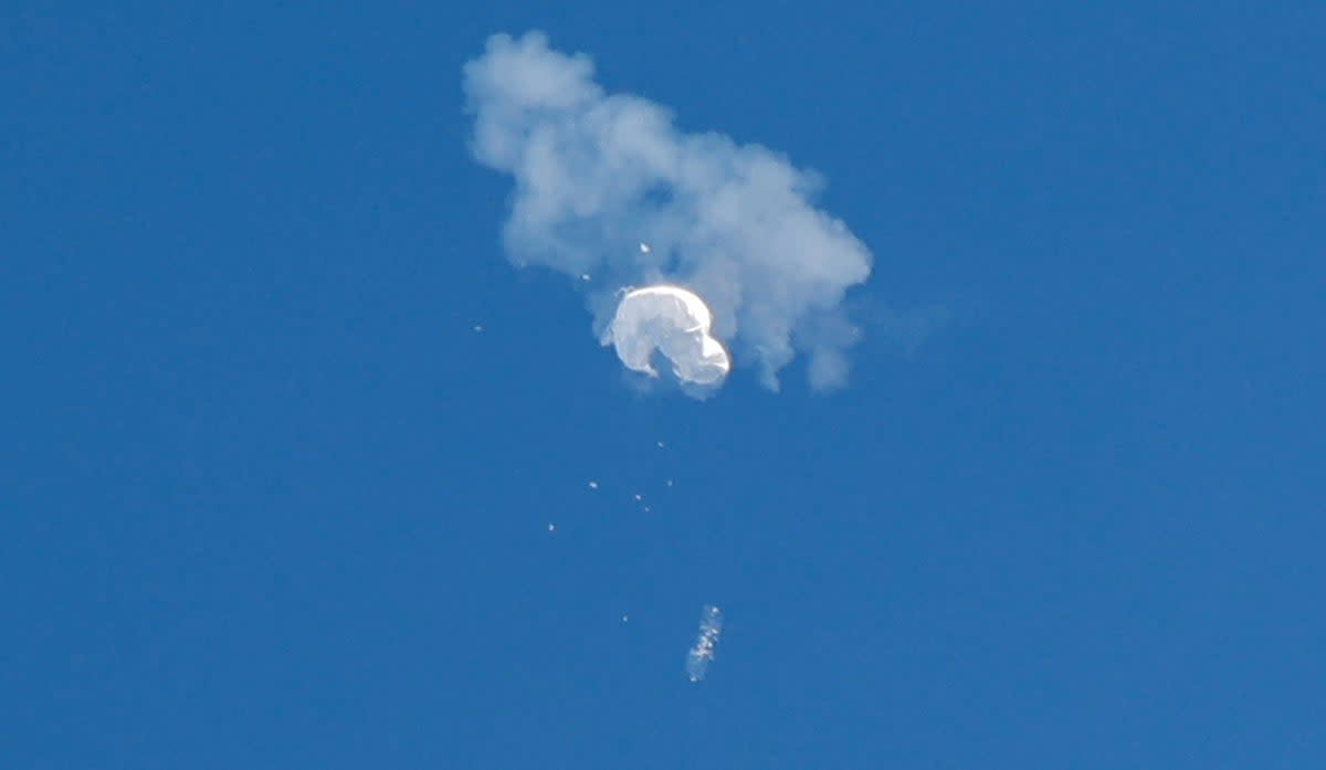 The suspected Chinese spy balloon drifts to the ocean after being shot down off the coast in Surfside Beach (REUTERS)