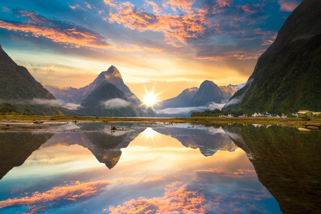 Famous Mitre Peak rising from the Milford Sound fiord. Fiordland national park, New Zealand