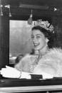 <p>During her first year as Queen of England, Elizabeth was snapped as she arrived at Westminster to open Parliament.</p>