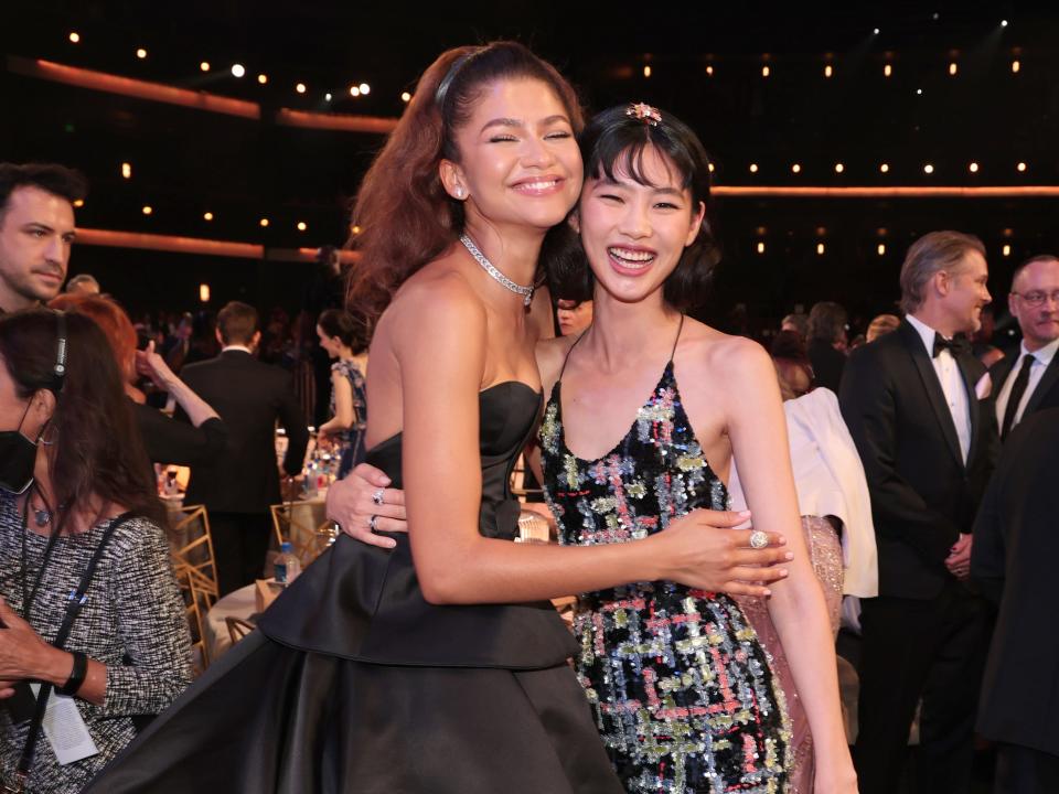 zendaya and hoyeon both grin and pose together at the emmys