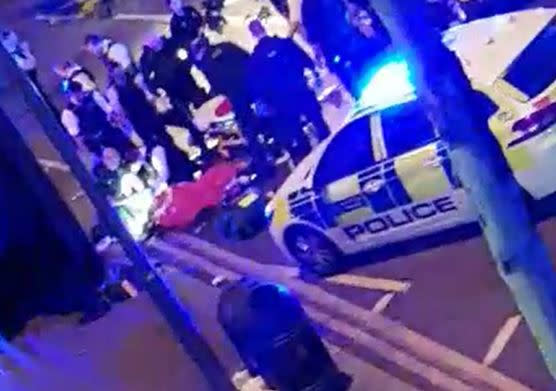 Handout screengrab from video of police and ambulance services treating someone at the scene in Leyton, east London, where an officer was stabbed shortly before midnight after attempting to stop a van.