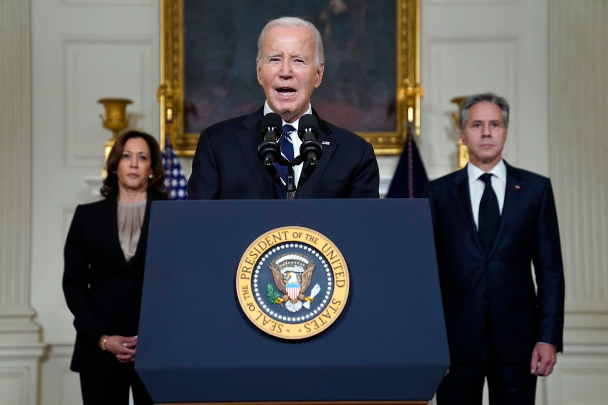President Joe Biden speaks Tuesday, Oct. 10, 2023, in the State Dining Room of the White House in Washington, about the war between Israel and the militant Palestinian group Hamas, as Vice President Kamala Harris and Secretary of State Antony Blinken listen. (AP Photo/Evan Vucci) (AP)