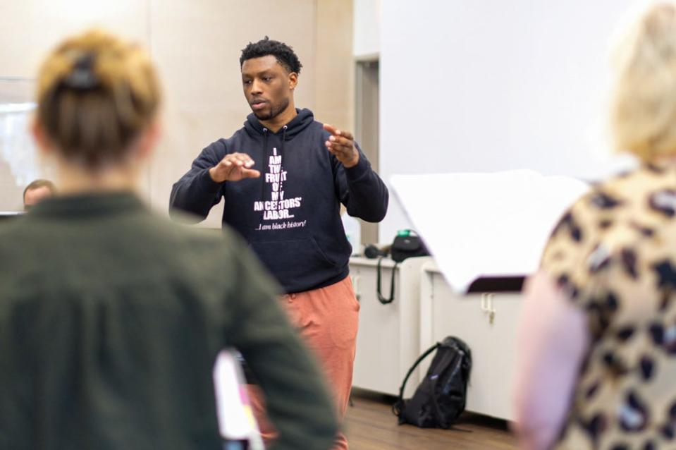 Emorja Roberson conducts a rehearsal for his oratorio, "BE-SPOKEN," which tells the story of Black people in America and uses the genres of classical, R&B, jazz and hip-hop in its music.