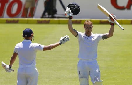 England's Ben Stokes celebrates scoring a double century with Jonny Bairstow during the second cricket test match against South Africa in Cape Town, South Africa, January 3, 2016. REUTERS/Mike Hutchings