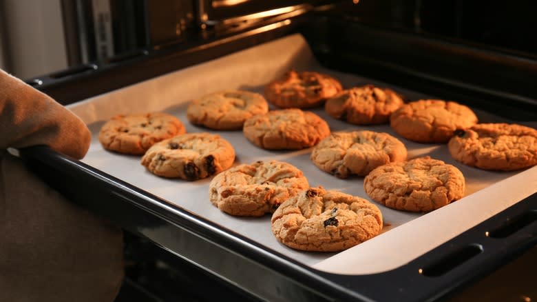 Removing baked cookies from oven