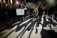 Protesters chant "Hands up, don’t shoot!" while facing riot police during nationwide unrest following the death in Minneapolis police custody of George Floyd, in Raleigh