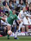 Ireland forward Marissa Sheva (24) moves the ball past United States defender Emily Fox (23) during the first half of an international friendly soccer match in Austin, Texas, Saturday, April 8, 2023. (AP Photo/Eric Gay)