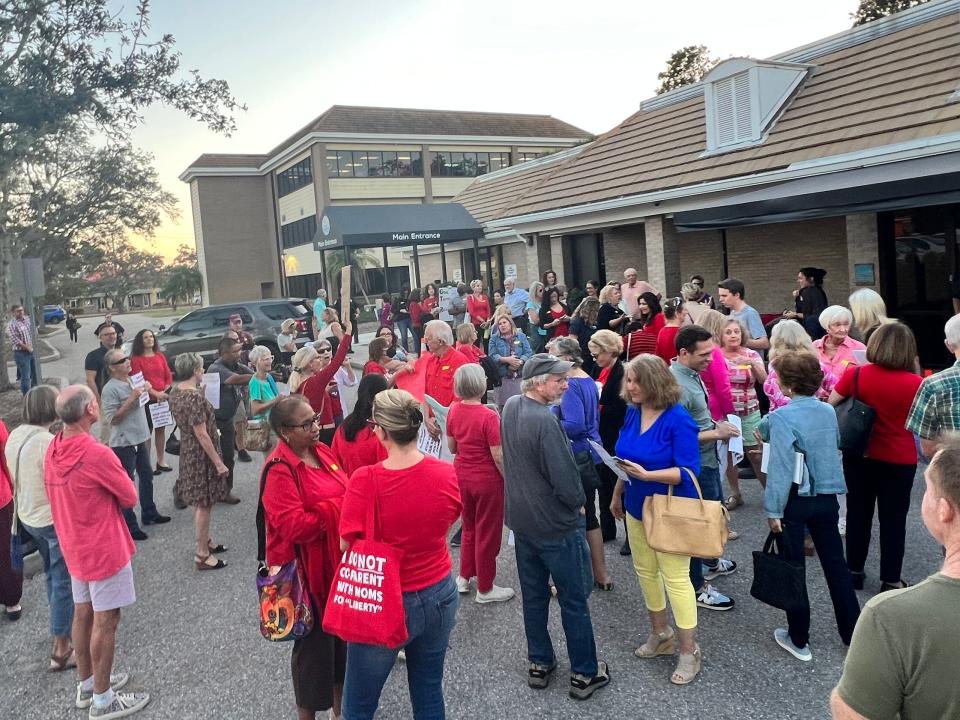 A crowd gathers outside of the Sarasota School District building ahead of the meeting where the board voted to approve Brennan Asplen's resignation Tuesday, Dec. 13, 2022.