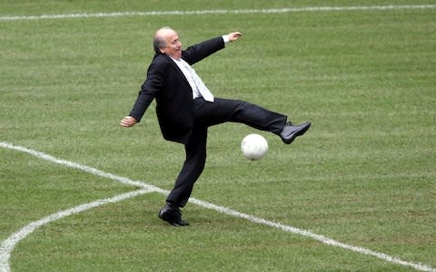 Sepp Blatter misses the ball  - Credit: AP