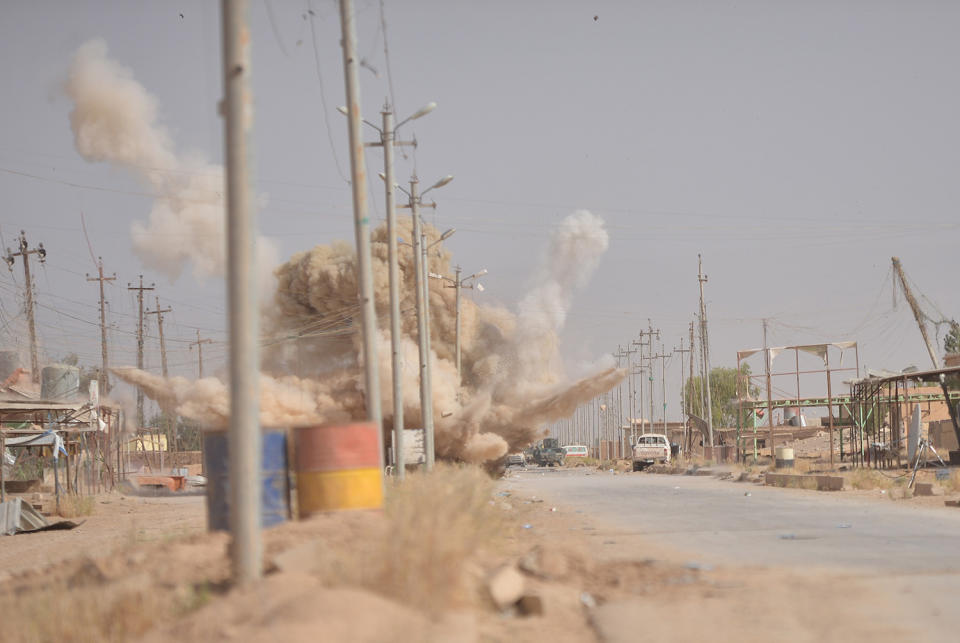 Smoke rises from a bomb attack in clashes west of Mosul