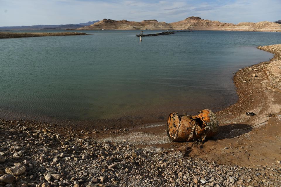 A rusted metal barrel, near the location of where a different barrel was found containing a human body, sits exposed on shore during low water levels due to the western drought at Lake Mead on May 5, 2022.