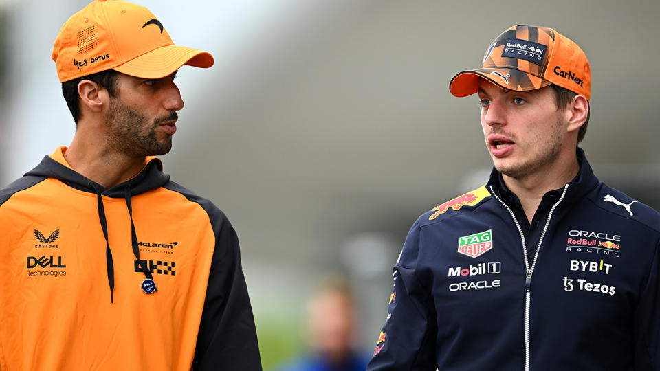 Daniel Ricciardo is pictured talking with Max Verstappen.