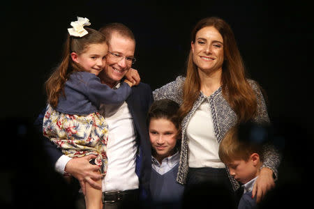 Ricardo Anaya poses with his wife Carolina Martinez and his children after announcing his participation as a presidential pre-candidate for the coalition known as "For Mexico in Front" that brings together the conservative National Action Party (PAN), the centre-left Party of the Democratic Revolution (PRD) and the Citizens Movement party, in Mexico City, Mexico, December 10, 2017. REUTERS/Edgard Garrido