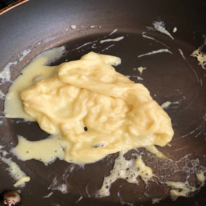 Plant-based scrambled eggs cooking.