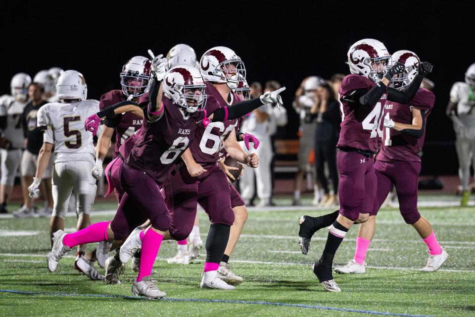 The Northbridge defense celebrates a turnover to start the second half versus Millbury.