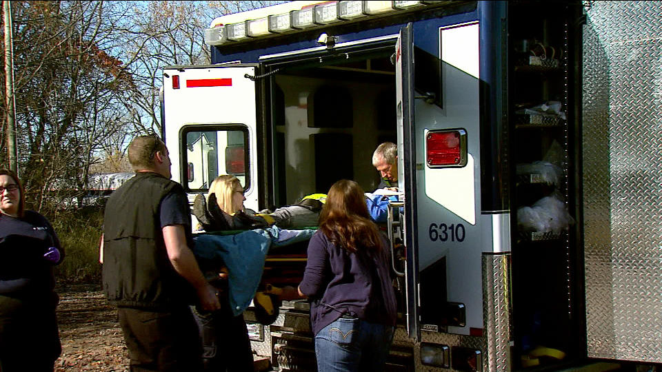 This image provided by WSBT-TV shows paramedics helping an Amtrak passenger into an ambulance after the train she was on derailed Sunday, Oct. 21, 2012 near Niles in southwest Michigan. An Amtrak spokesman said about a dozen people were hurt, none seriously in the incident. (AP Photo/WSBT-TV)