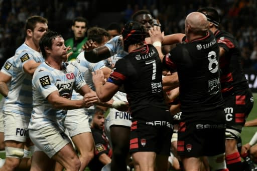 A first-half brawl marred league leaders Lyon's fifth win of the season who beat Racing 92