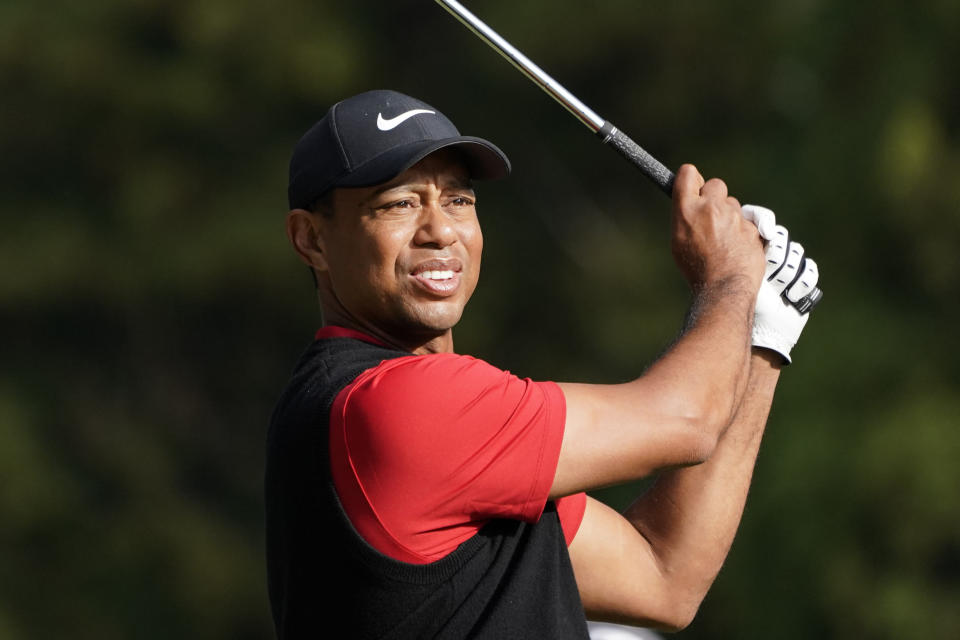 FILE - In this Monday, Oct. 28, 2019 file photo, Tiger Woods of the United States watches his tee shot on the 16th hole during the final round of the Zozo Championship PGA Tour at the Accordia Golf Narashino country club in Inzai, east of Tokyo, Japan. Woods is in the Bahamas this week as a player and a host, and in Australia next week as a player and Presidents Cup captain.(AP Photo/Lee Jin-man, File)