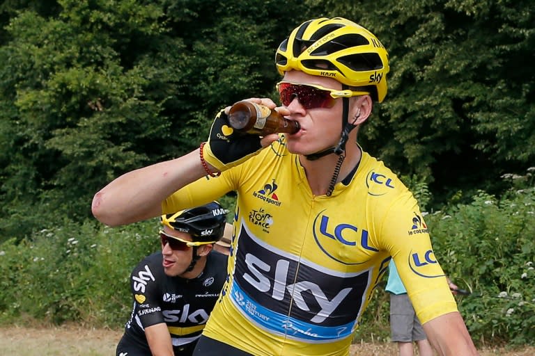 Great Britain's Chris Froome drinks a beer at the start final stage of the Tour de France on July 24, 2016